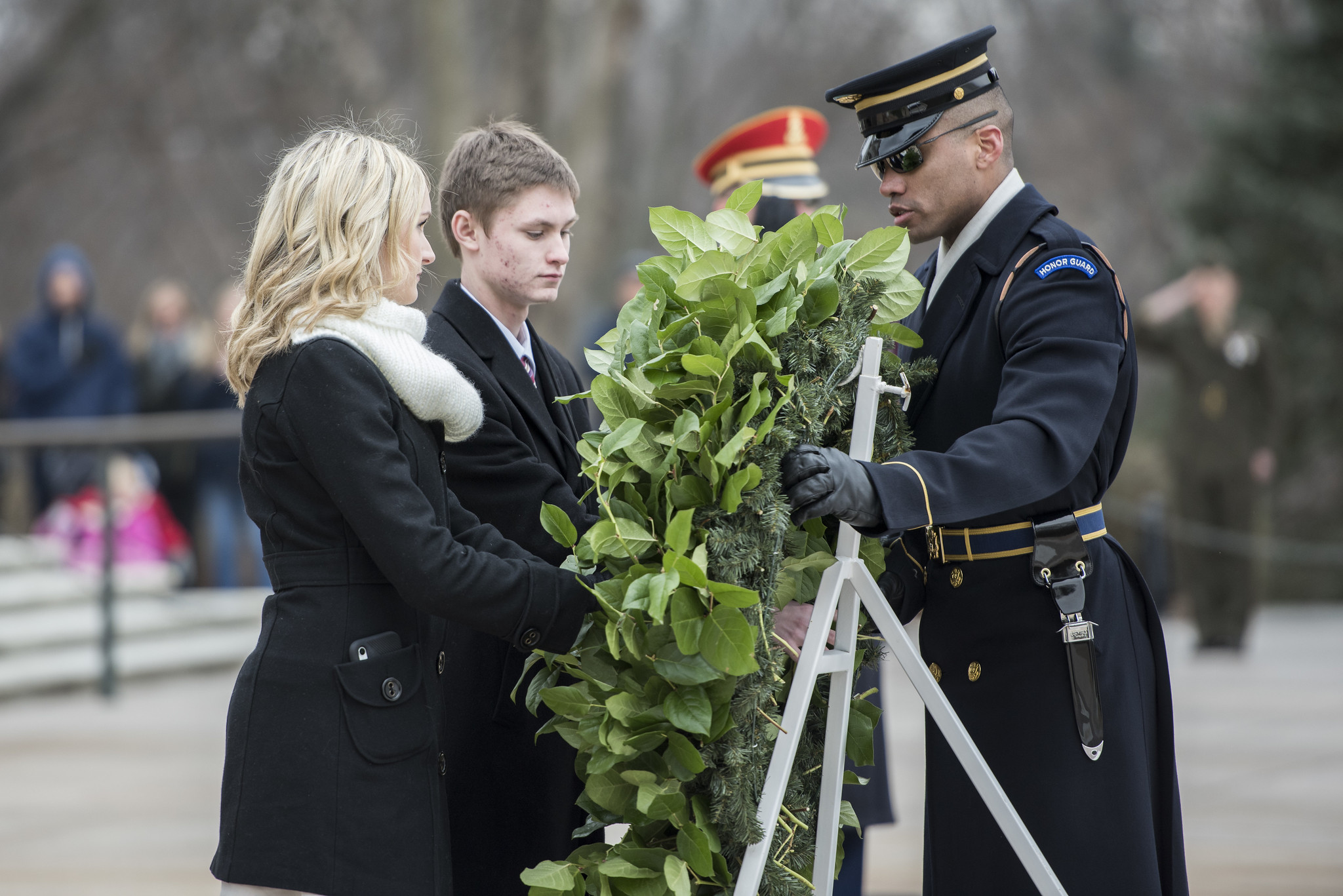 about-ceremony-dress-code Two teenagers, wearing appropriate attire, participate in a wreath ceremony at the Tomb of the Unknown Soldier