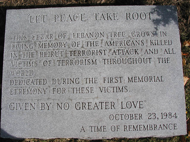 explore-monuments-beirut-barracks Beirut Barracks Memorial, with inscription reading, Let peace take root. This cedar of Lebanon tree grows in living memory of the Americans killed in the Beirut terrorist attack and all victims of terrorism throughout the world. Dedicated during the first memorial ceremony for these victims. Given by No Greater Love, October 23, 1984, A Time of Remembrance