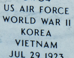 Dark lithochrome letters on grave stone